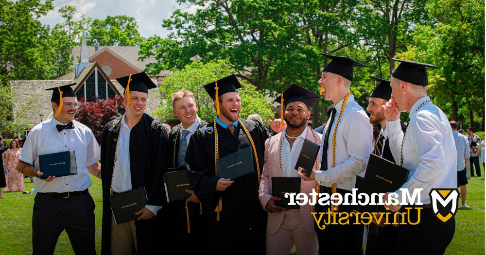 Students celebrate together after graduation.